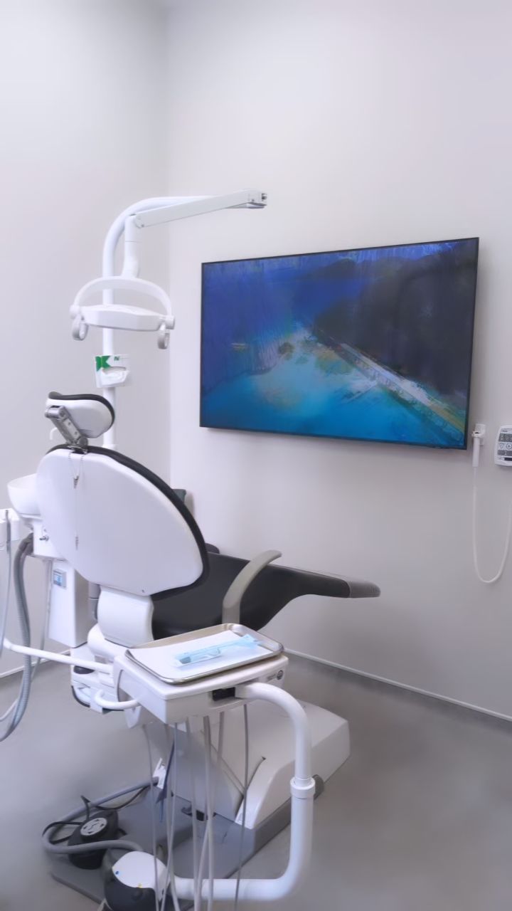 Modern treatment room with patient-comfort ceiling TV